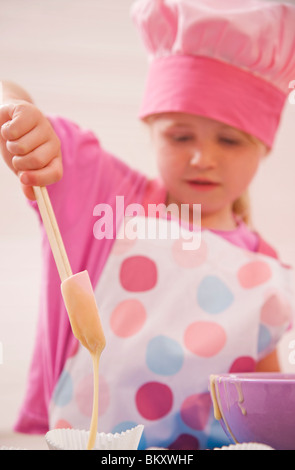 Close up of a young girl baking