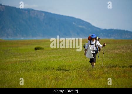 One man backpacks and surfs on The Lost Coast, California. Stock Photo