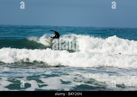 A man surfs on The Lost Coast, California. Stock Photo