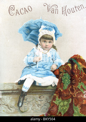 Young Girl Dressed in Blue Sitting on a Stone Wall with her Sun Umbrella Stock Photo