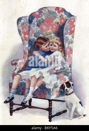 Boy and Girl Kissing on a Floral Chair Stock Photo