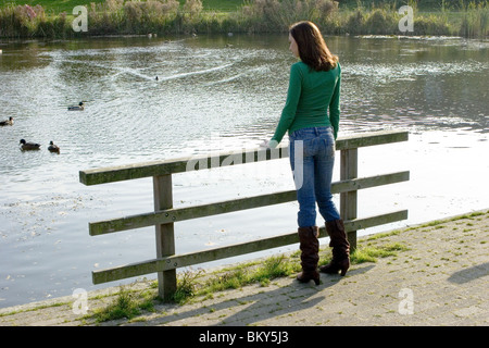 Young anonymous woman alone outdoors feeling lonely