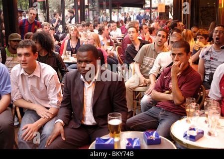 Paris, France, Large Crowd People, Young Adults Watching Sports Audience, Soccer Football Match on French Television , Café Terrace, Stock Photo