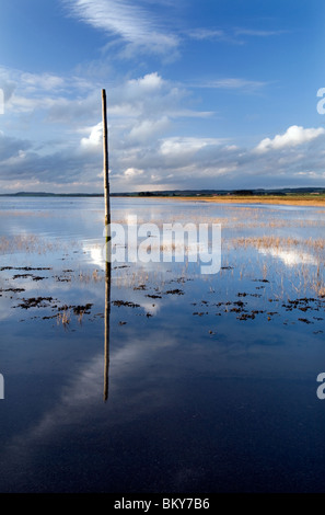 One of the Pilgrims Way Marker Posts on Lindisfarne Causeway Stock Photo