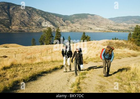 A group of climbers walk to towards a climb in British Columbia. Stock Photo