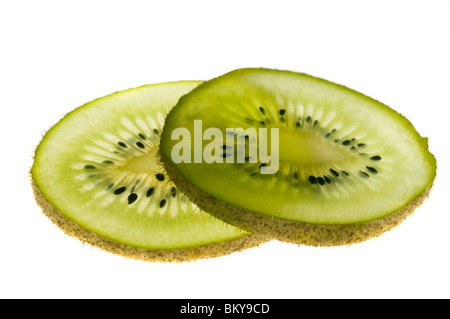 two overlapping slices of kiwi fruit, backlit and isolated against a white background, Stock Photo