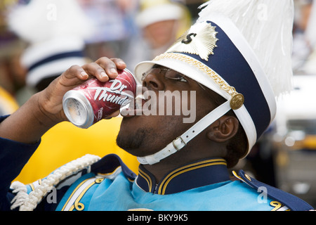 Man having a drink, Carnival Parade on Mardi Gras, French Quarter, New Orleans, Louisiana, USA Stock Photo