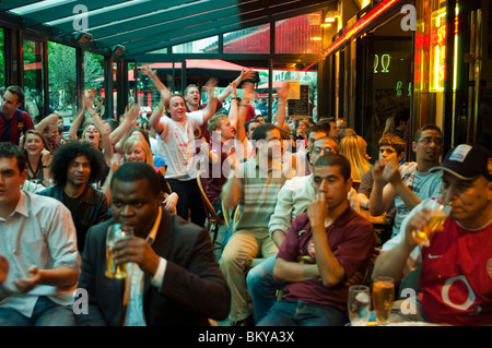 Paris, France, Crowded Paris Cafe BIstro Bar Young Adults, French Audience, Watching Soccer Sports Match on Television interior Stock Photo