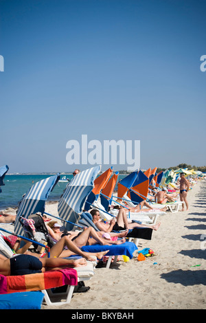 People sunbathing at beach, Tigaki, Kos, Greece Stock Photo