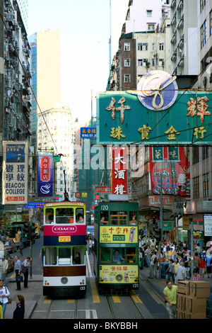 Double decker tram and neon signs, Hong Kong, China Stock Photo