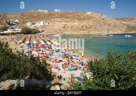 People bathing at Super Paradise Beach, knowing as a centrum of gays and nudism, Psarou, Mykonos, Greece Stock Photo