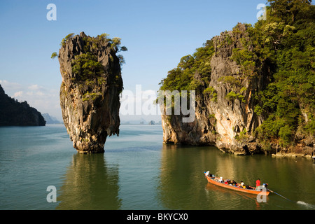 View to Koh Tapu, so-called James Bond Island, The Man with the Golden Gun, people in a longtail boat in foreground, Ko Khao Phi Stock Photo