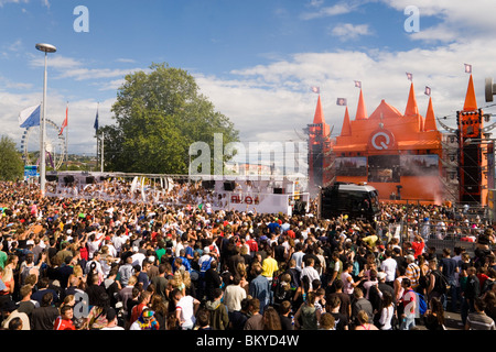 Lots of ravers dancing around a Love Mobile near Quai Bridge, Street Parade (the most attended technoparade in Europe), Zurich, Stock Photo