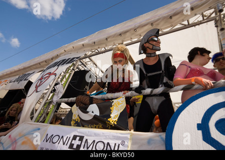 Dressed up young people on a Love Mobile near Quai Bridge, Street Parade (the most attended technoparade in Europe), Zurich, Can Stock Photo