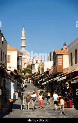 View along shopping street Odos Sokratous, Mosque of Suleyman in background, Rhodes Town, Rhodes, Greece, (Since 1988 part of th Stock Photo
