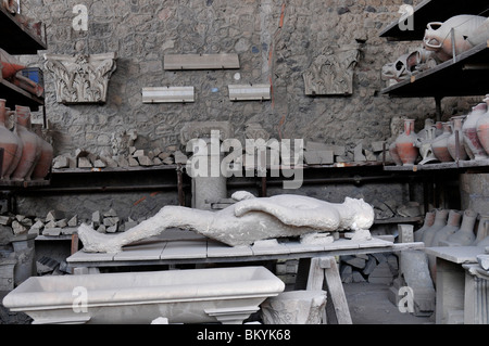 Plaster cast of a victim of the Vesuvius eruption in 79AD in the granary store at Pompeii Italy Stock Photo