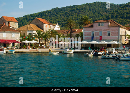 Croatia; Hrvartska; Kroatien, Hvar Island; Strai Grad, town square, cafes, fishboats tied-up on waterfront of old town Stock Photo