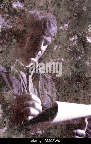 Man looking down holding pen doing a drawing or writing Stock Photo