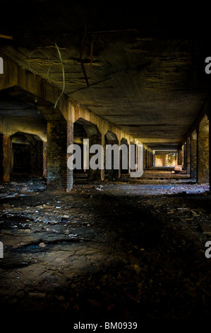 Derelict coal bunker in large building Stock Photo
