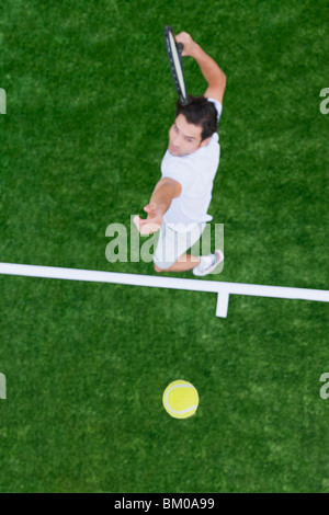 Man playing tennis Stock Photo