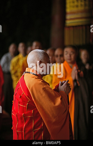 monk, abbot, prayer, Taihuai, Wutai Shan, Five Terrace Mountain, Buddhist Centre, town of Taihuai, Shanxi province, China, Asia Stock Photo