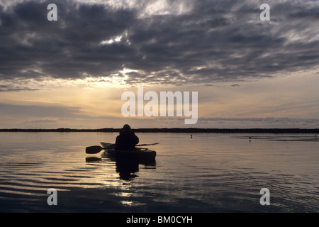 Kayaking on Okarito Lagoon at Sunset, Okarito, West Coast, South Island, New Zealand Stock Photo