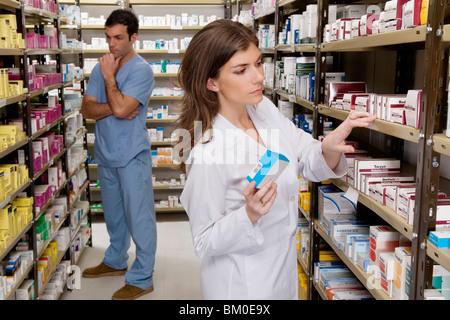 Pharmacists working in a pharmacy Stock Photo