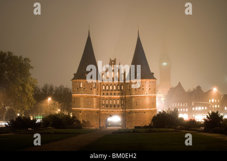 The Holstentor, a Luebeck landmark with St. Mary's church, Marienkirche on the left and the church of St. Petri on the right, Ha Stock Photo