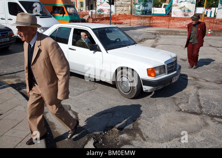 elegant old men and Mercedes 190 car in Tirana, the capital of Albania. Stock Photo