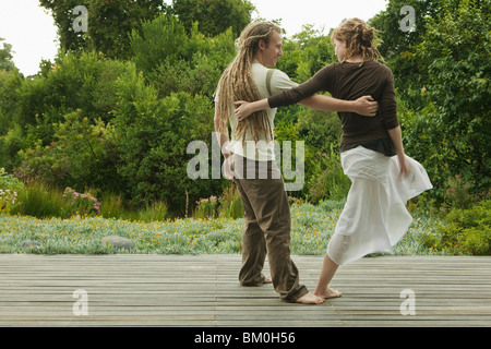 Man and woman dancing outdoors Stock Photo