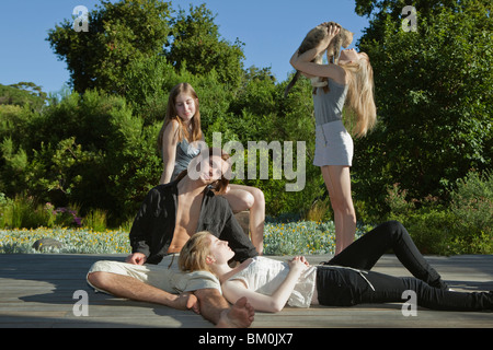 Group of young adults lying in sun