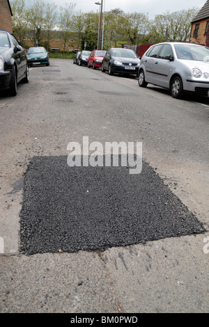 Repaired pot hole in a suburban road in Hounslow, Middx, UK. May 2010.  See BM0P3Y for original pot hole view. Stock Photo