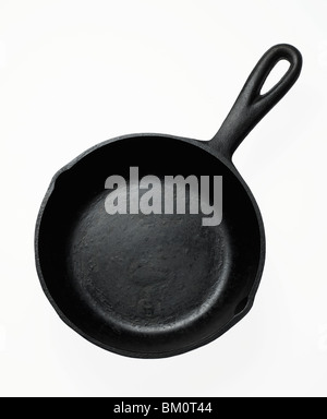 Old, rusty, cast-iron pan for baking cornbread sticks in the shape of corn  on the cob isolated against a white background Stock Photo - Alamy