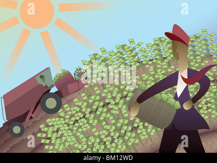 Businessman harvesting money from a field Stock Photo
