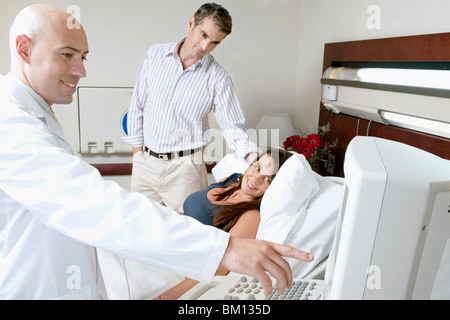 Pregnant woman going through an ultrasound scan Stock Photo