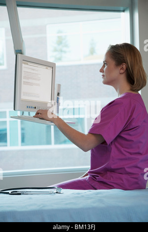 Female doctor working on a computer Stock Photo
