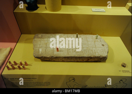 Senet or senat is an ancient Egypt board game that consists of ten or more pawns on a 30-square playing board, Yale Peabody Museum, New Haven, Connect Stock Photo