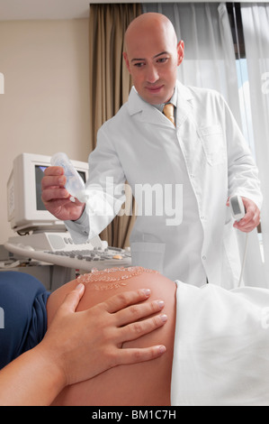 Pregnant woman going through an ultrasound scan Stock Photo