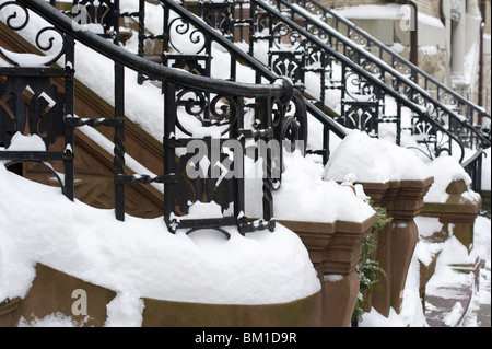 Snow on the iron railings of brownstone houses on the upper west side of Manhattan, New York City, New York State, USA Stock Photo