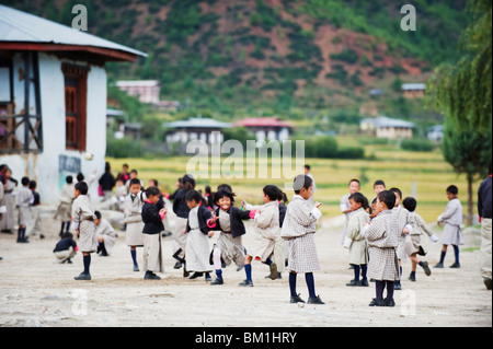 School children playing, Paro, Bhutan, Asia Stock Photo