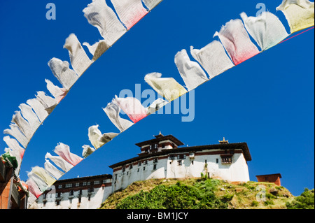 Prayer flags below Wangdue Phodrang Dzong, founded by the Zhabdrung in 1638, Bhutan, Asia Stock Photo