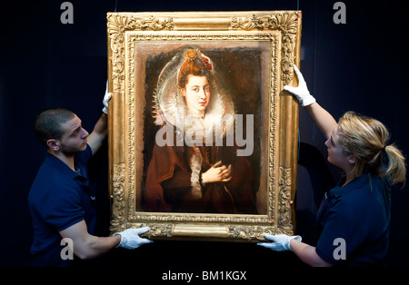 Sotheby's employees in front of a Sir Peter Paul Rubens painting  'Portrait of a young woman' Stock Photo