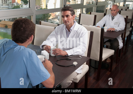 Doctors during coffee break a cafeteria Stock Photo