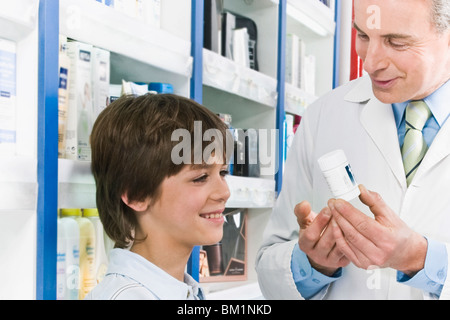 Pharmacist talking with a boy Stock Photo