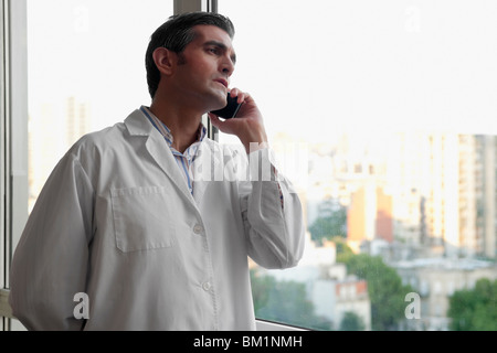 Doctor talking on a mobile phone Stock Photo