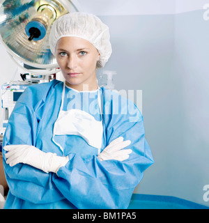 Female surgeon looking serious in an operating room Stock Photo