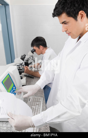 Two researchers working in a laboratory Stock Photo