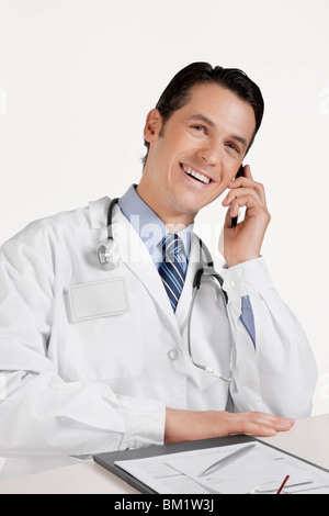 Doctor talking on a mobile phone Stock Photo