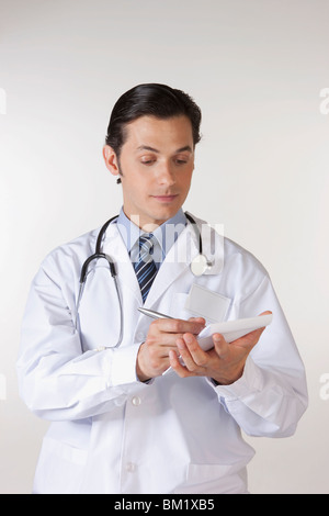 Doctor writing a prescription Stock Photo