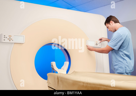 Technician operating an MRI scanner Stock Photo